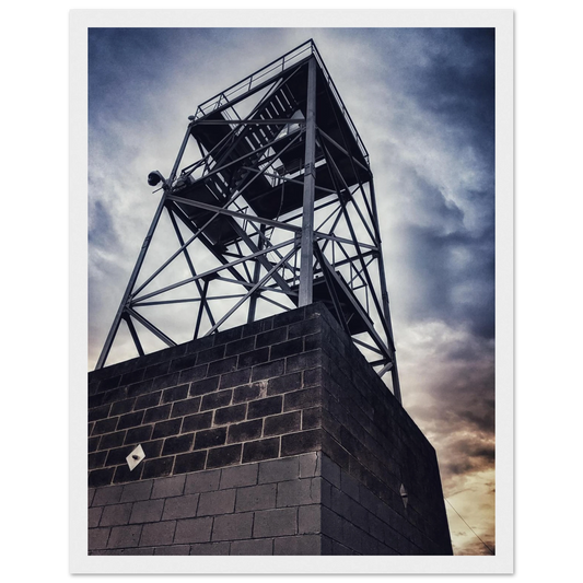 Industrial steel lookout tower in Lakes Entrance, captured at a low angle and in high contrast, against a moody sky